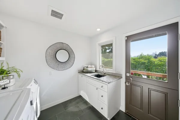 a bedroom with a large bed and a couch