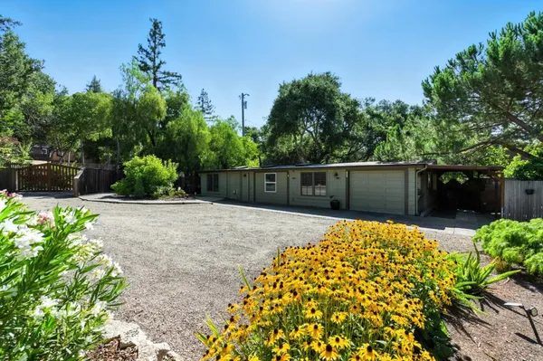 front view of a house with a garden