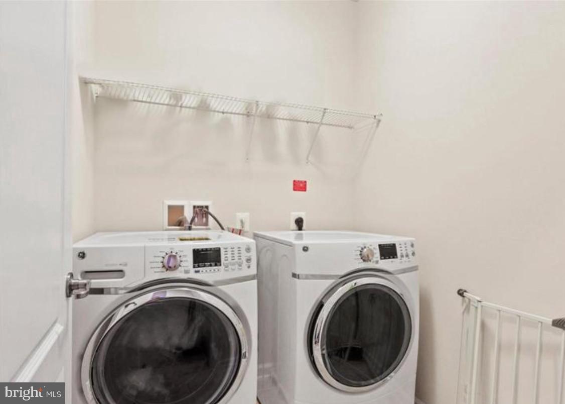 4843 Dane Ridge Circle Woodbridge, VA 22193 - Photo 18 of 24 Modern laundry space with sleek appliances.