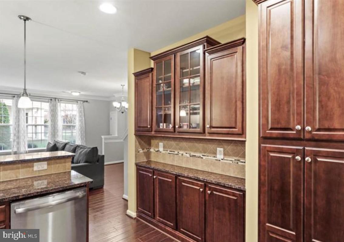 4843 Dane Ridge Circle Woodbridge, VA 22193 - Photo 3 of 24 Elegant kitchen with rich wood cabinetry.