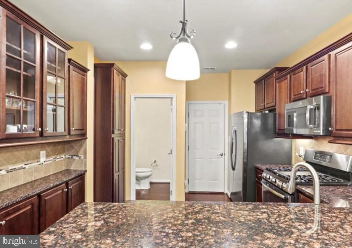 4843 Dane Ridge Circle Woodbridge, VA 22193 - Photo 5 of 24 Modern kitchen with rich wood accents.