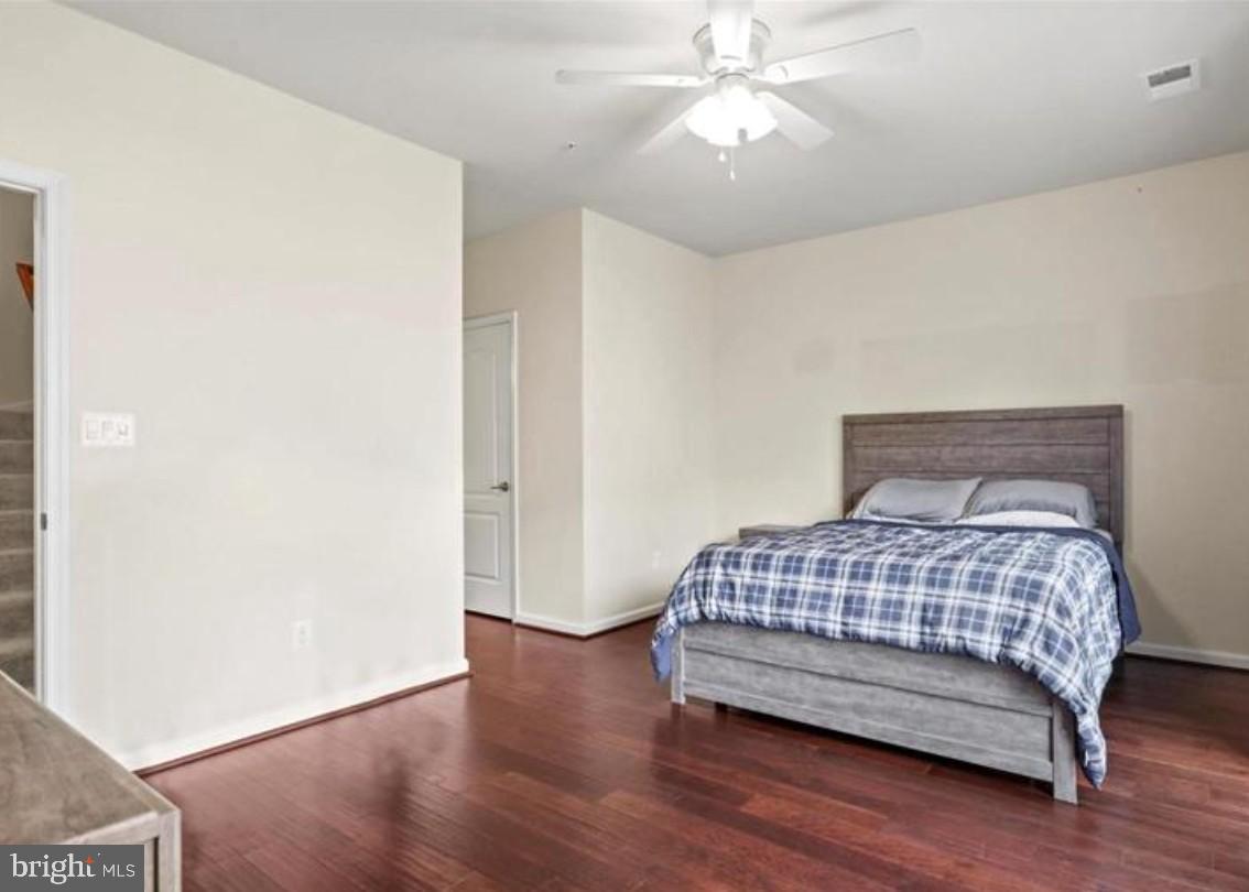 4843 Dane Ridge Circle Woodbridge, VA 22193 - Photo 9 of 24 Spacious bedroom with warm wooden floors.