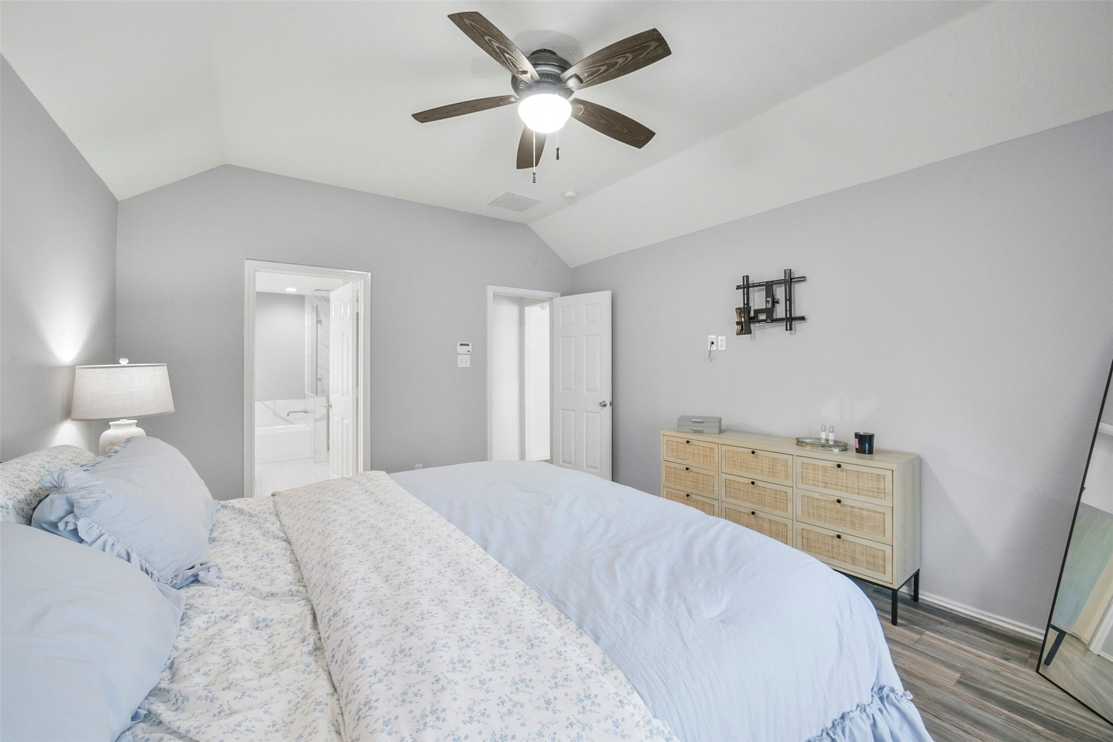 38 Tallow Hill Place Spring, TX 77382 - Photo 21 of 50 a bedroom with a bed and a chandelier
