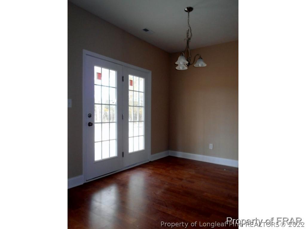 3463 Thrower Road Hope Mills, NC 28348 - Photo 7 of 24 a view of a livingroom with a ceiling fan and window