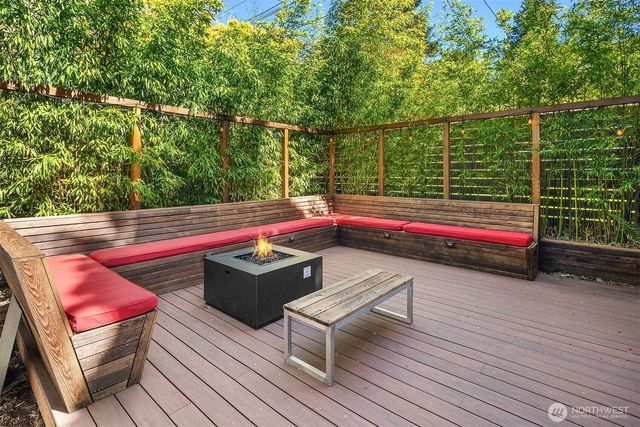 a small space filled with furniture and wooden deck