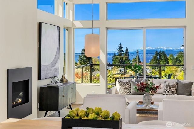 a living room with furniture fireplace and window