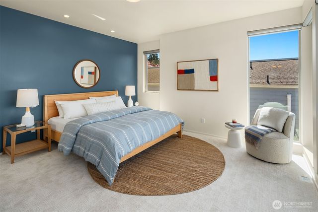 a bedroom with bed and a couch