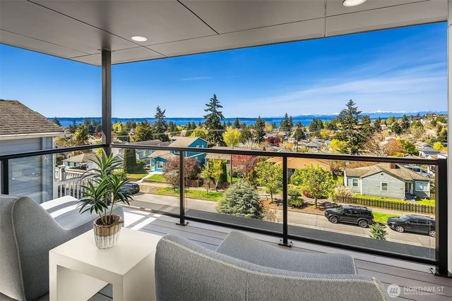 a view of a balcony with chairs