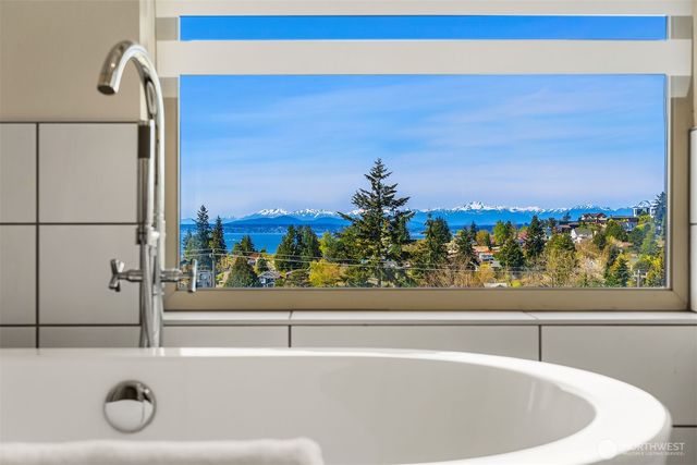 a bathroom with a sink double vanity and a shower