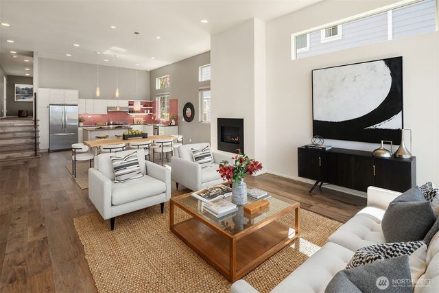 a living room with furniture and a mirror