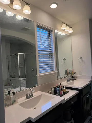 a bathroom with a sink and a mirror