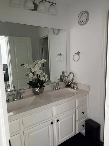 a bedroom with a bed and a desk