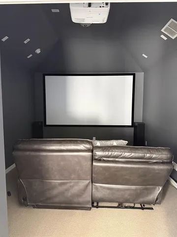 a bedroom with a bed and wall painting