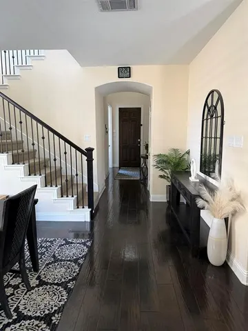 a view of living room with furniture and wooden floor