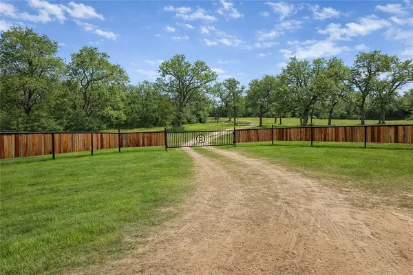 a swimming pool with wooden fence