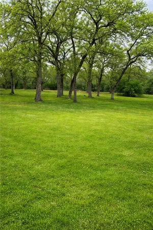 a view of outdoor space with deck and yard