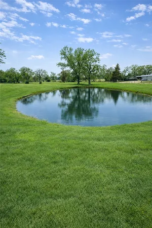 a view of a lake with houses in the back