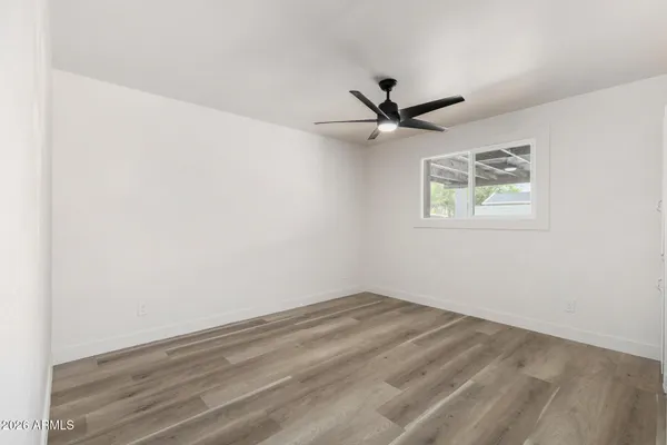 a bathroom with a toilet sink and shower