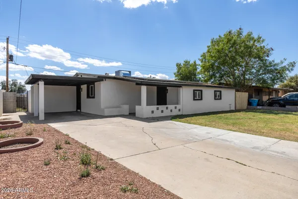 a front view of a house with yard