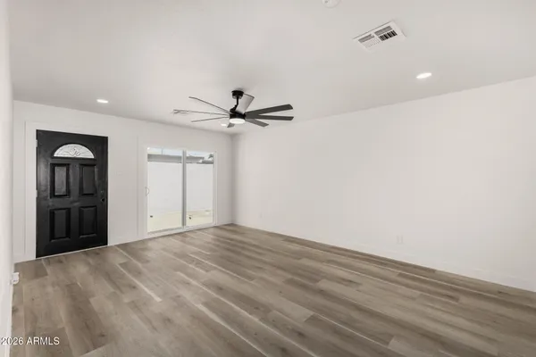 a view of an empty room with a window