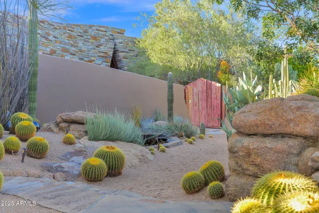 a backyard of a house with yard and outdoor seating