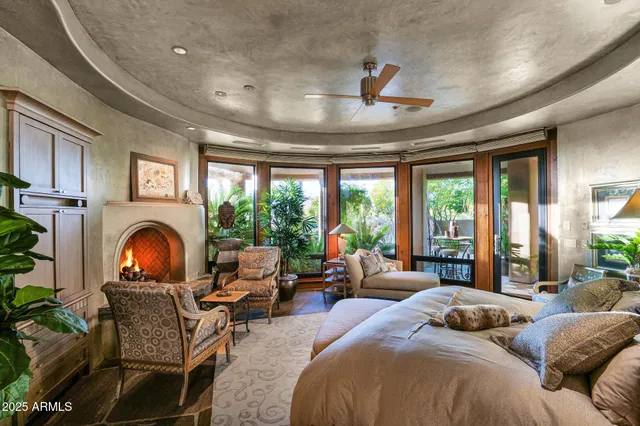 a view of a patio with table and chairs under an umbrella
