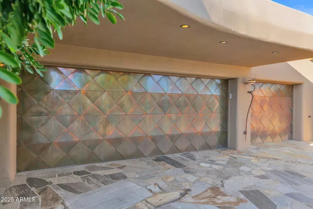 a view of a backyard with plants and tree