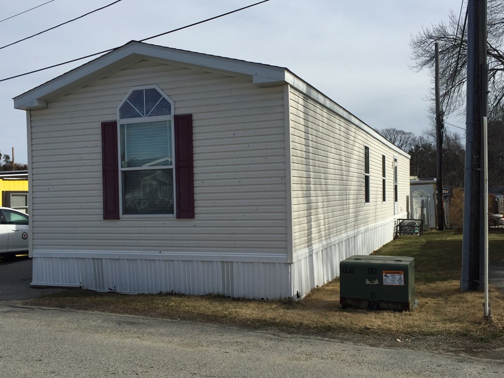 557-122 Southwest Cutoff Worcester, MA 01607 - Photo 1 of 12 a front view of a house with parking