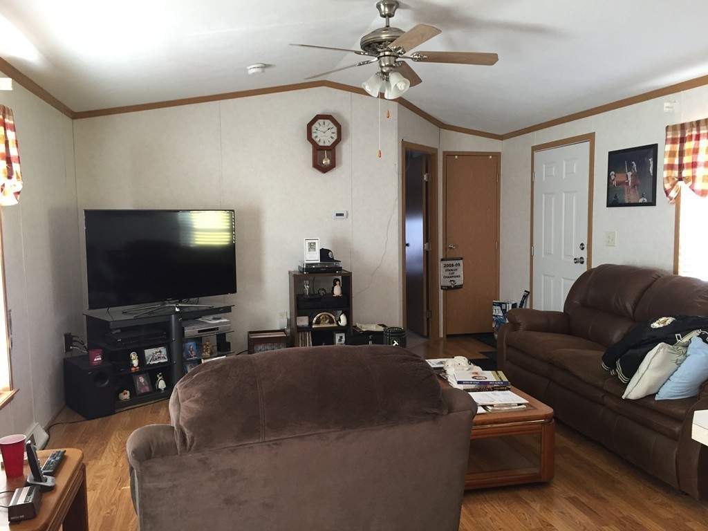557-122 Southwest Cutoff Worcester, MA 01607 - Photo 3 of 12 a living room with furniture and a flat screen tv