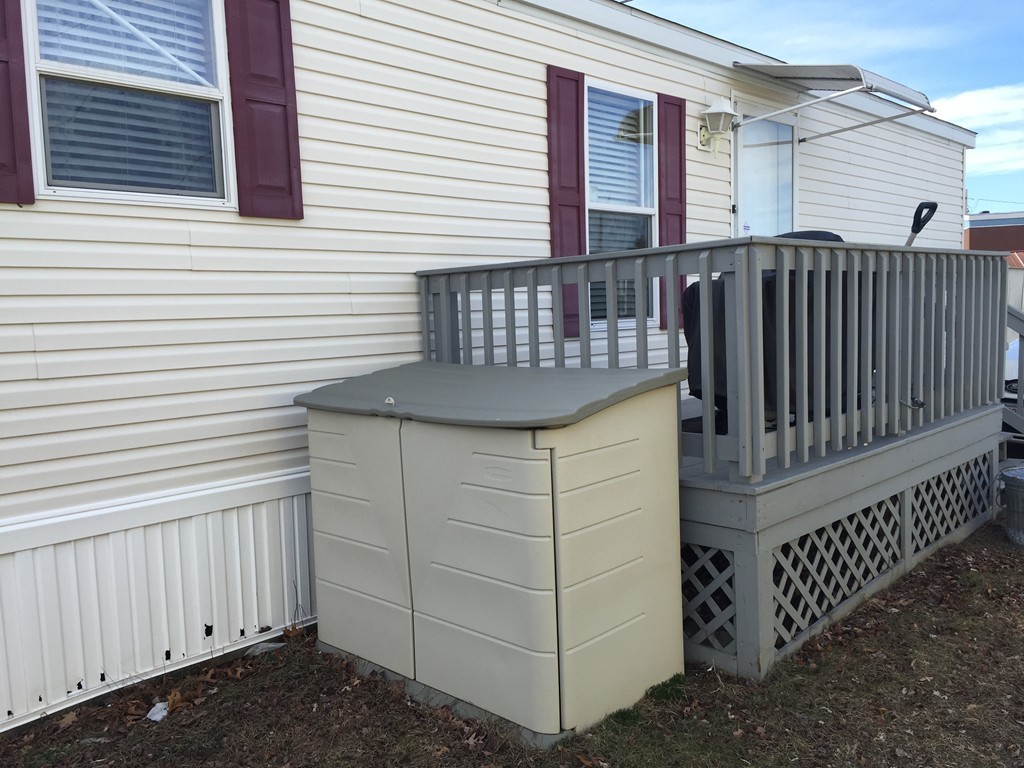 557-122 Southwest Cutoff Worcester, MA 01607 - Photo 10 of 12 a view of a house with wooden fence