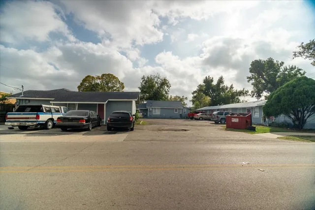 a view of street and parked cars