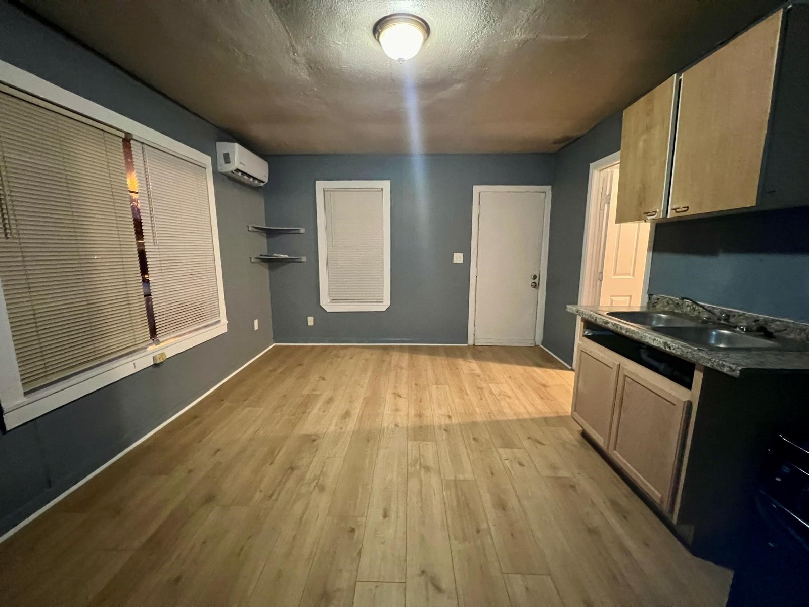 13928 Bandera Street Houston, TX 77015 - Photo 16 of 40 a kitchen with a wooden floor and a stove top oven