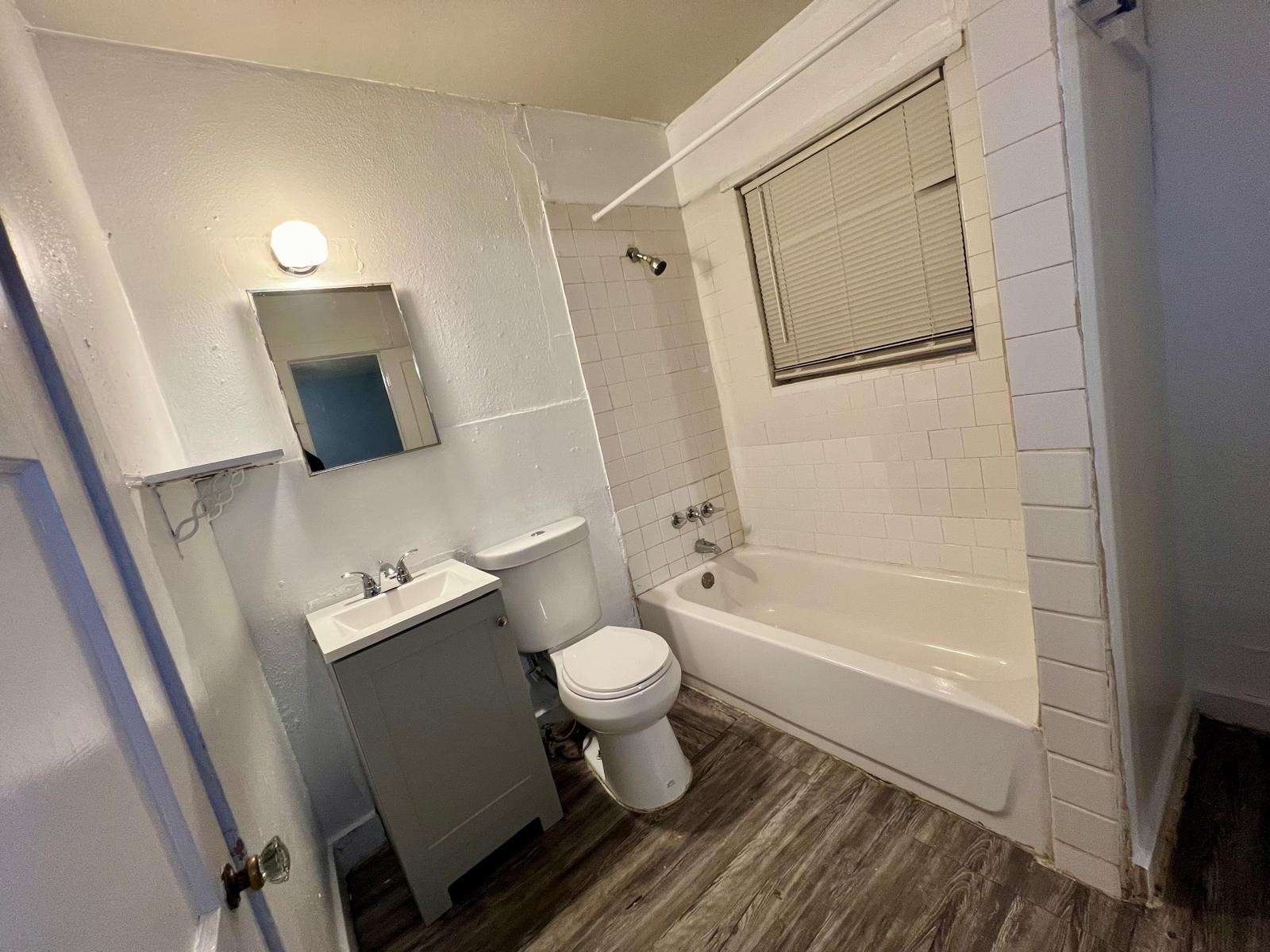 13928 Bandera Street Houston, TX 77015 - Photo 21 of 40 a bathroom with a toilet a sink and bathtub