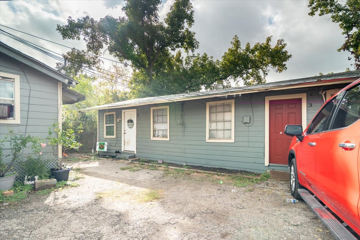 13928 Bandera Street Houston, TX 77015 - Photo 24 of 40 a backyard of a house with large trees and barbeque oven