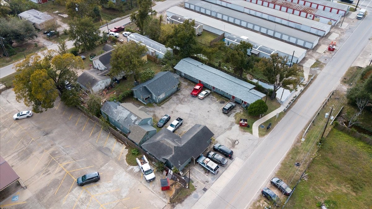 13928 Bandera Street Houston, TX 77015 - Photo 32 of 40 A wider aerial angle highlights the property’s position within the neighborhood, showing nearby streets, adjacent lots, and the overall layout of the grounds.
