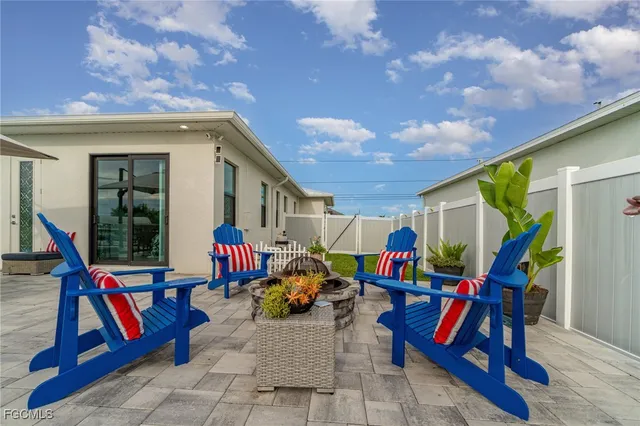 a bed room with furniture and flat screen tv