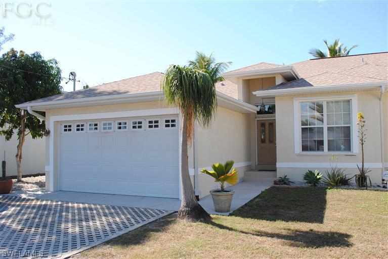 3325 Stringfellow Road, Unit A St. James City, FL 33956 - Photo 1 of 21 a view of a entryway door front of house