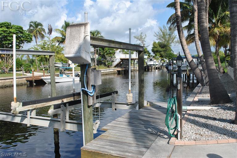 3325 Stringfellow Road, Unit A St. James City, FL 33956 - Photo 19 of 21 a lake view with tables and chairs