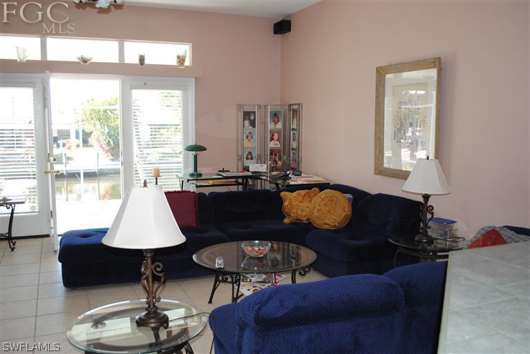 3325 Stringfellow Road, Unit A St. James City, FL 33956 - Photo 2 of 21 a living room with furniture and a table