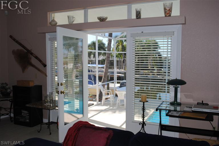 3325 Stringfellow Road, Unit A St. James City, FL 33956 - Photo 4 of 21 a dining room with furniture and floor to ceiling window
