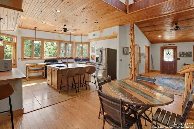 a view of a dining room with furniture window and outside view