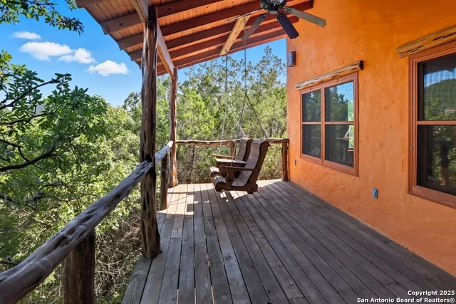 a sitting area with furniture on wooden deck