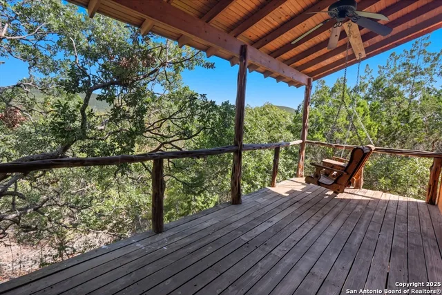 a view of a two chairs in the balcony