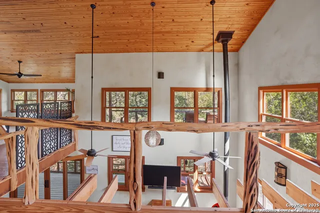 a large white kitchen with a large window