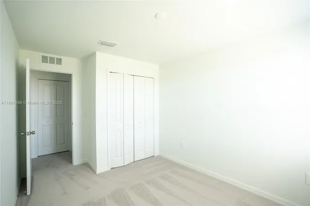 a view of a hallway with windows