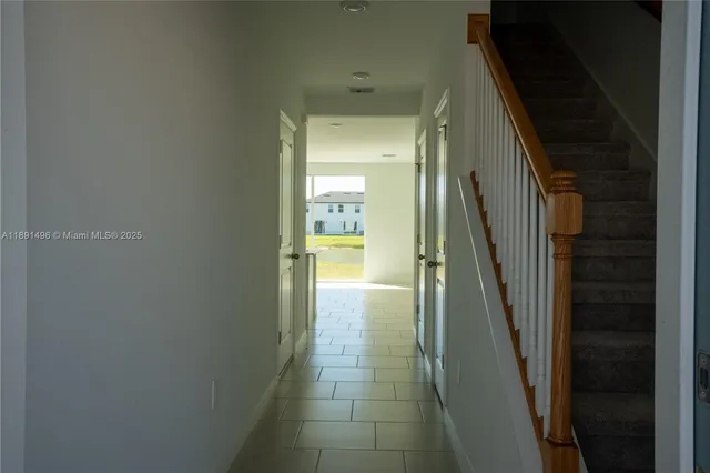 a view of kitchen with stainless steel appliances kitchen island sink refrigerator and stove