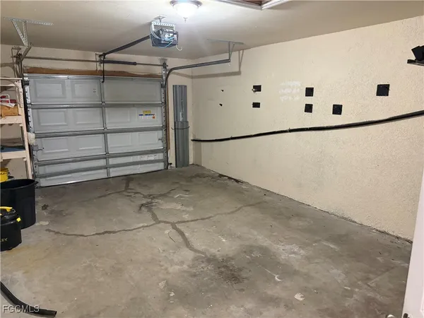 a view of a garage with shelf