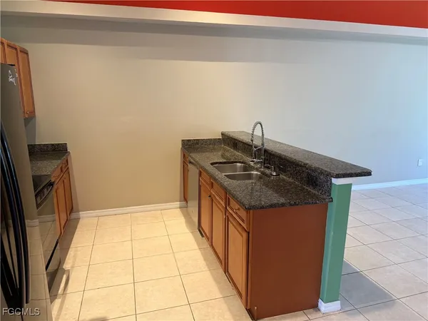 a kitchen that has a sink and a stove