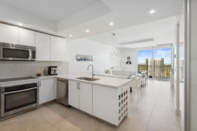 a kitchen with a sink stove and cabinets