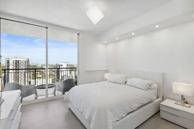 a bed room with a bed and a night stand